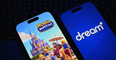Dream Games and Royal Match logos are seen on mobile screens, May 1, 2025. (AA Photo)