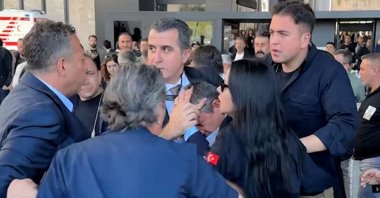 Özgür Özel (C) writhes in pain after the attack, Istanbul, Türkiye, May 4, 2025. (AA Photo)