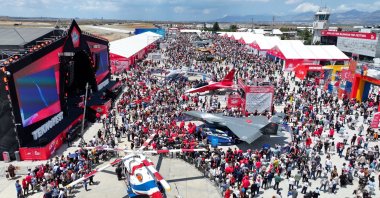 An aerial view of the Teknofest area showcasing domestically developed platforms, including fighter jet Kızılelma (2-L), Hürjet (C) and Bayraktar Akıncı (R) along with visitors, Lefkoşa (Nicosia), Turkish Republic of Northern Cyprus (TRNC), May 4, 2025. (AA Photo)