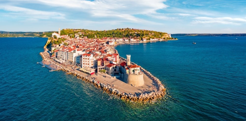 Attractive morning cityscape of Piran, highlighting the town&#039;s charming coastal beauty and historic architecture. (Shutterstock Photo)