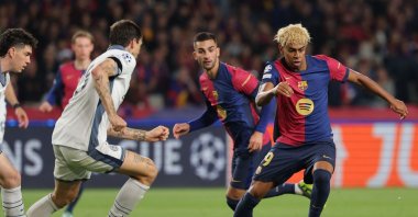 Barcelona&#039;s Lamine Yamal (R) fends off a challenge from Inter Milan&#039;s Francesco Acerbi (L) during the UEFA Champions League semifinal first leg at Estadi Olimpic Lluis Companys, Barcelona, Spain, April 30, 2025. (AFP Photo)