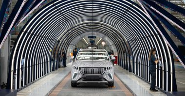 Employees work on a car assembly line at a Togg factory at the Gemlik Togg Technology Campus, Bursa, northwestern Türkiye, May 17, 2024. (AFP Photo)