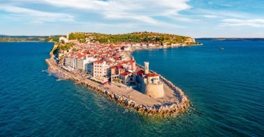 Attractive morning cityscape of Piran, highlighting the town&#039;s charming coastal beauty and historic architecture. (Shutterstock Photo)