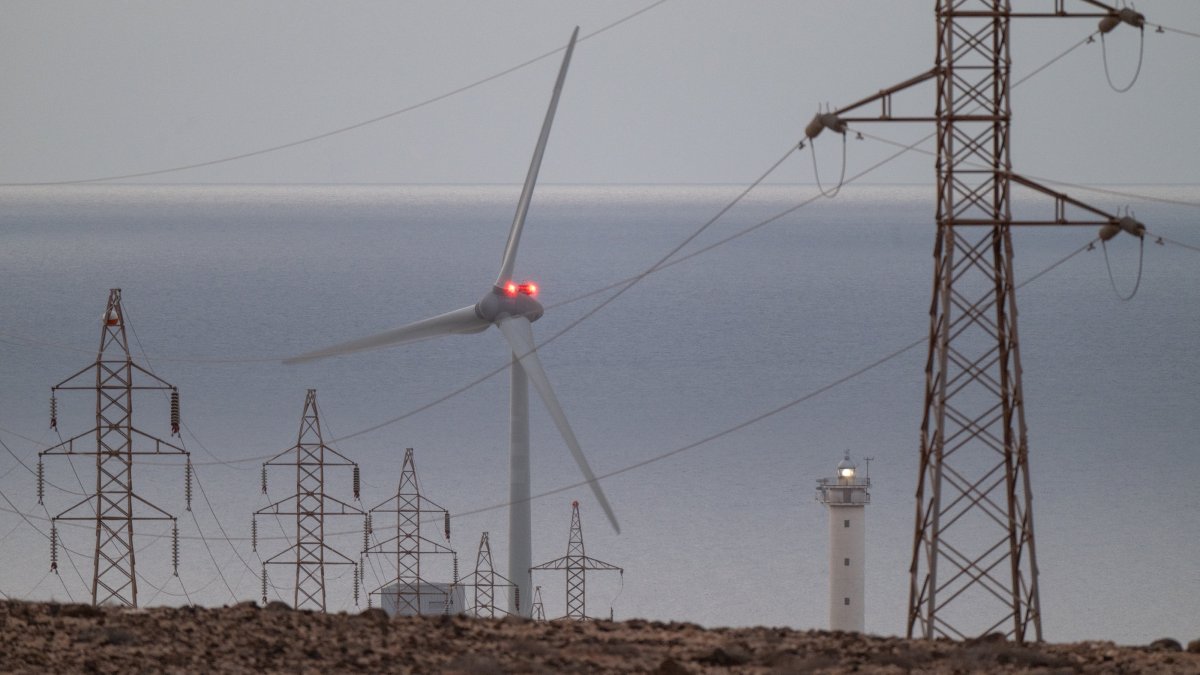 High voltage power lines and a wind turbine on Fuerteventura Island, Canary Islands, southwestern Spain, April 29, 2025. (EPA Photo)