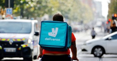 A delivery worker with Deliveroo rides a bike, Nice, France, Oct. 25, 2022. (Reuters Photo)
