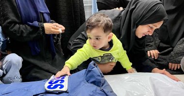 Relatives mourn over the body of journalist Ahmed Mansur at the Nasser Medical Complex in Khan Younis, southern Gaza Strip, Palestine, April 8, 2025. (AFP Photo)