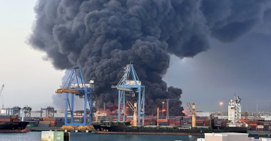 A column of smoke rises after a seaport was targeted by drone strikes carried out by RSF paramilitaries, Port Sudan, Sudan, May 6, 2025. (AA Photo)
