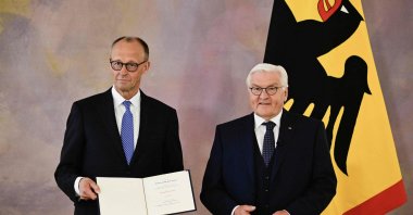 Friedrich Merz (L) receives his certificate of appointment from German President Frank-Walter Steinmeier after he was elected as Germany&amp;#039;s new Chancellor, at the presidential Bellevue Palace in Berlin, Germany, May 6, 2025. (AFP Photo)