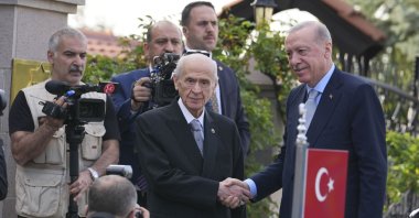 President Recep Tayyip Erdoğan (R) shakes hands with Devlet Bahçeli, the head of the Nationalist Movement Party (MHP), ahead of their meeting at Bahçeli&amp;#039;s residence, in the capital Ankara, Türkiye, May 6, 2025. (AA Photo)