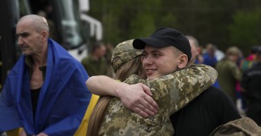 Ukrainian prisoners of war (POWs) react following a prisoner swap at an undisclosed location in Ukraine, May 6, 2025. (EPA Photo)