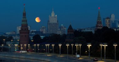 A partial lunar eclipse is seen over the towers of the Kremlin and Russia&#039;s Foreign Ministry headquarters, Moscow, Russia, Sept. 18, 2024. (Reuters Photo)