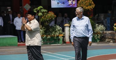 Microsoft co-founder and former CEO Bill Gates (R) and Indonesian President Prabowo Subianto greet the crowd during their visit to an elementary school, Jakarta, Indonesia, May 7, 2025. (EPA Photo)