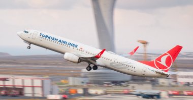 Turkish Airlines Boeing 737-9F2ER &quot;TC-JYC&quot; departure from Istanbul Airport with view of the Control Tower, Istanbul, Türkiye, Nov. 7, 2024. (Shutterstock Photo)