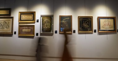 People pass by artworks displayed at the &quot;Loyalty&quot; exhibition at Dolmabahçe Palace, Istanbul, Türkiye, May 7, 2025. (AA Photo)