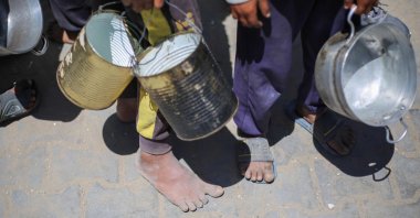 Palestinian children queue for a hot meal at a charity kitchen at the Nuseirat refugee camp, central Gaza Strip, Palestine, April 26, 2025. (AFP Photo)