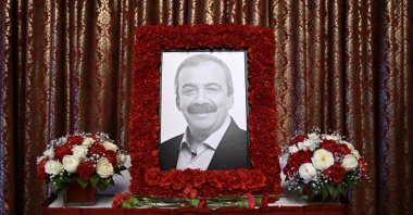A portrait of the late Sırrı Süreyya Önder sits on an altar during a commemoration ceremony at Parliament, Ankara, Türkiye, May 7, 2025. (AA Photo)