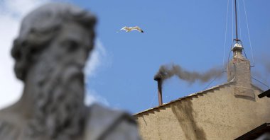 Black smoke comes out of the chimney atop the Sistine Chapel next to St. Peter's Basilica on the second day of the conclave to elect a new pope in Vatican City, May 8, 2025. (EPA Photo)