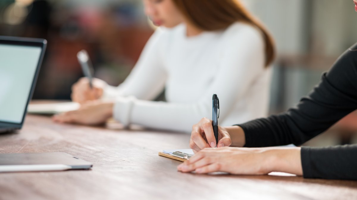 An international student takes an exam in a university classroom. (Shutterstock Photo)