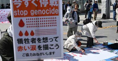 People draw red tear drops for Palestinians in Sapporo, Hokkaido Prefecture, Japan, April 7, 2024. (Reuters Photo)