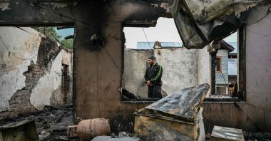 A man stands inside his house destroyed by Pakistani artillery shelling at the Salamabad village, Uri, Kashmir, May 8, 2025. (AFP Photo)