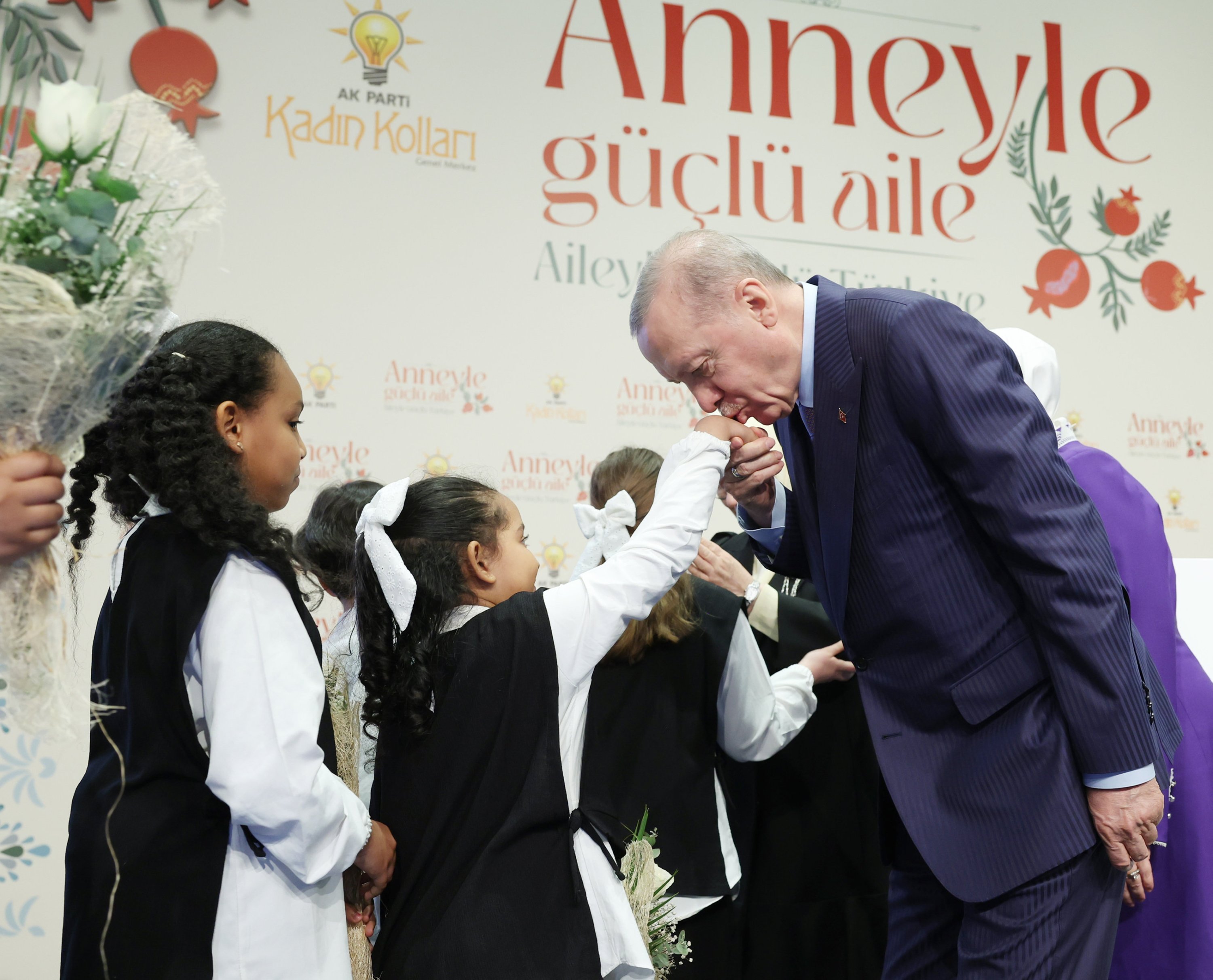 President Recep Tayyip Erdoğan greets children during the “Strong Family with Mother, Strong Türkiye with Family” program organized by the AK Party Women's Branch at a hotel in Bahçelievler, Istanbul, Türkiye, May 10, 2025. (AA Photo)
