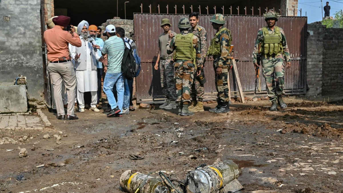 Indian army personnel stand next to explosives, carried by a drone, after it was intercepted by the Indian air defence system, on the outskirts of Amritsar, India, May 10, 2025. (AFP Photo)