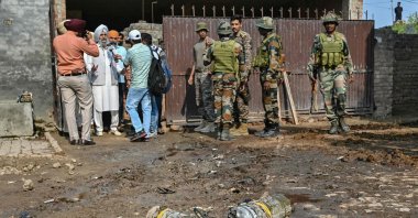 Indian army personnel stand next to explosives, carried by a drone, after it was intercepted by the Indian air defence system, on the outskirts of Amritsar, India, May 10, 2025. (AFP Photo)