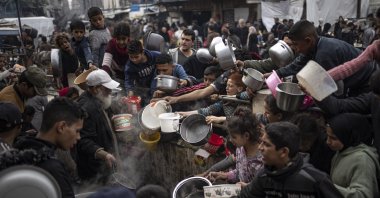 Palestinians line up for a meal in Rafah, Gaza Strip, Palestine, Dec. 21, 2023. (AP Photo)
