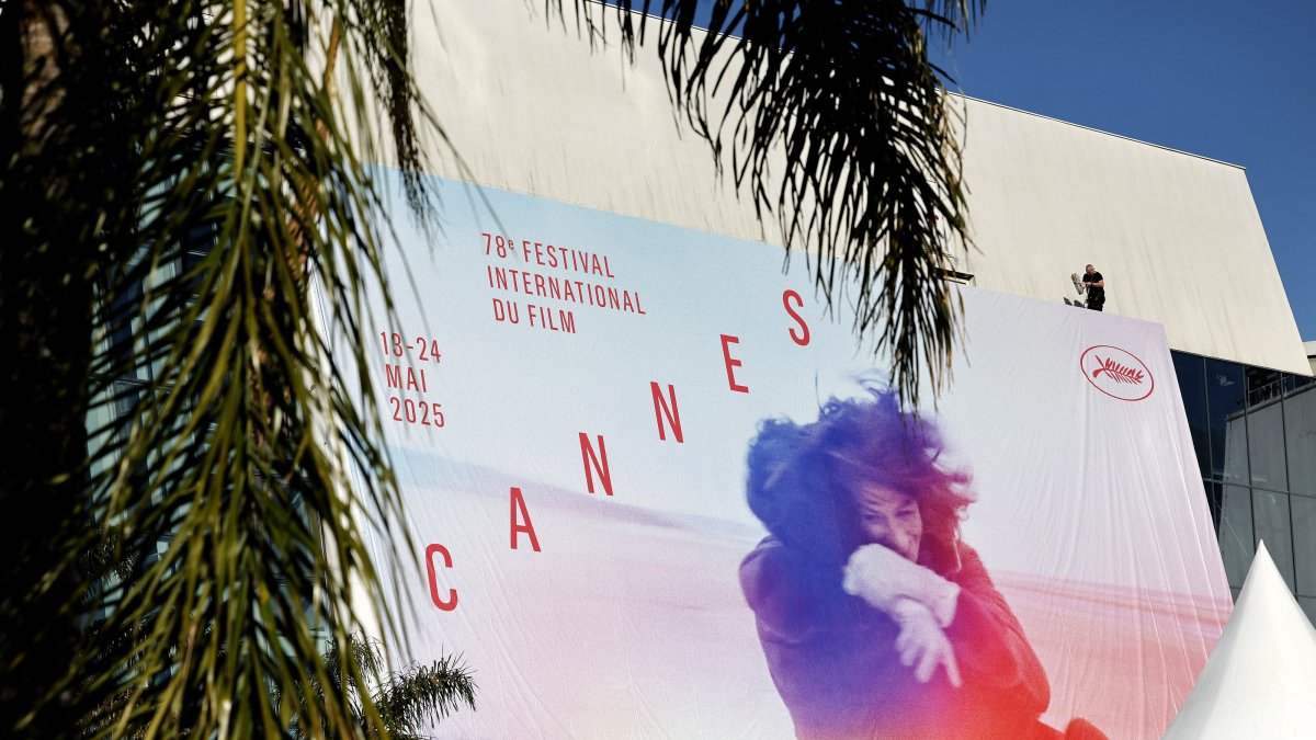 Workers set up the official poster of the 78th annual Cannes Film Festival on the Palais des Festivals facade, Cannes, France, May 11, 2025. (EPA Photo)