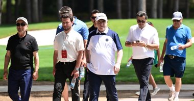 Youth and Sports Minister Osman Aşkın Bak (R) arrives at the Regnum Carya Golf Club in Belek, Antalya, Türkiye, May 11, 2025. (AA Photo)