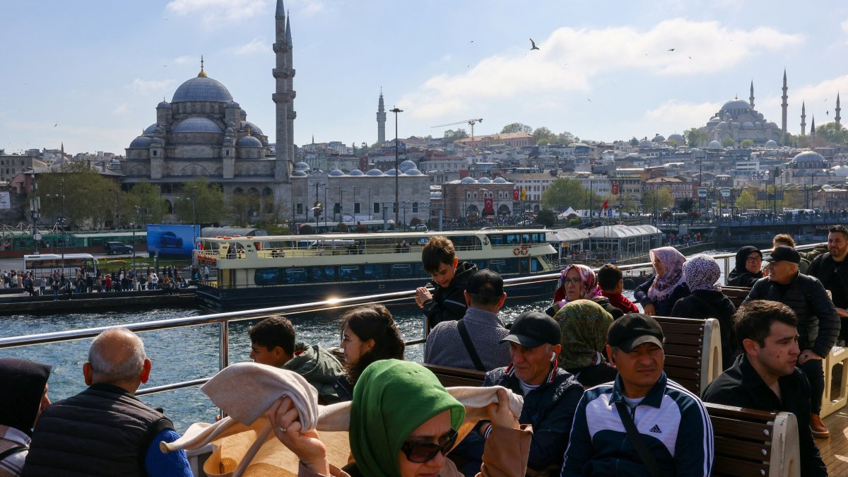 Tourists and commuters sail through the Bosporus on a ferry in Istanbul, Türkiye, April 23, 2025. (Reuters Photo)