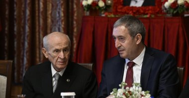 DEM Party co-chair Tuncer Bakırhan (R) talks to MHP leader Devlet Bahçeli (L), architect of the terror-free Türkiye initiative, at an event, Ankara, Türkiye, May 7, 2025. (AA Photo)
