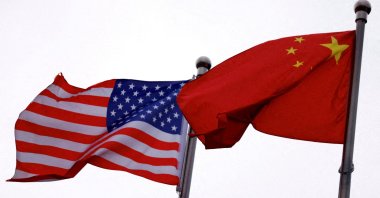 Chinese and U.S. flags flutter outside the building of an American company, Beijing, China, April 8, 2025. (Reuters Photo)