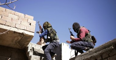 PKK terrorists get in position to attack Turkish security forces, Mardin, southeastern Türkiye, March 1, 2016. (AP Photo)