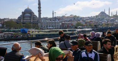 Tourists and commuters sail through the Bosporus on a ferry in Istanbul, Türkiye, April 23, 2025. (Reuters Photo)