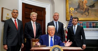 U.S. President Donald Trump gestures on the day he signs an executive order on prescription drug pricing, next to U.S. Health and Human Services (HHS) Secretary Robert F. Kennedy, Jr., during a press conference in the Roosevelt Room at the White House in Washington, D.C., U.S., May 12, 2025. (Reuters Photo)