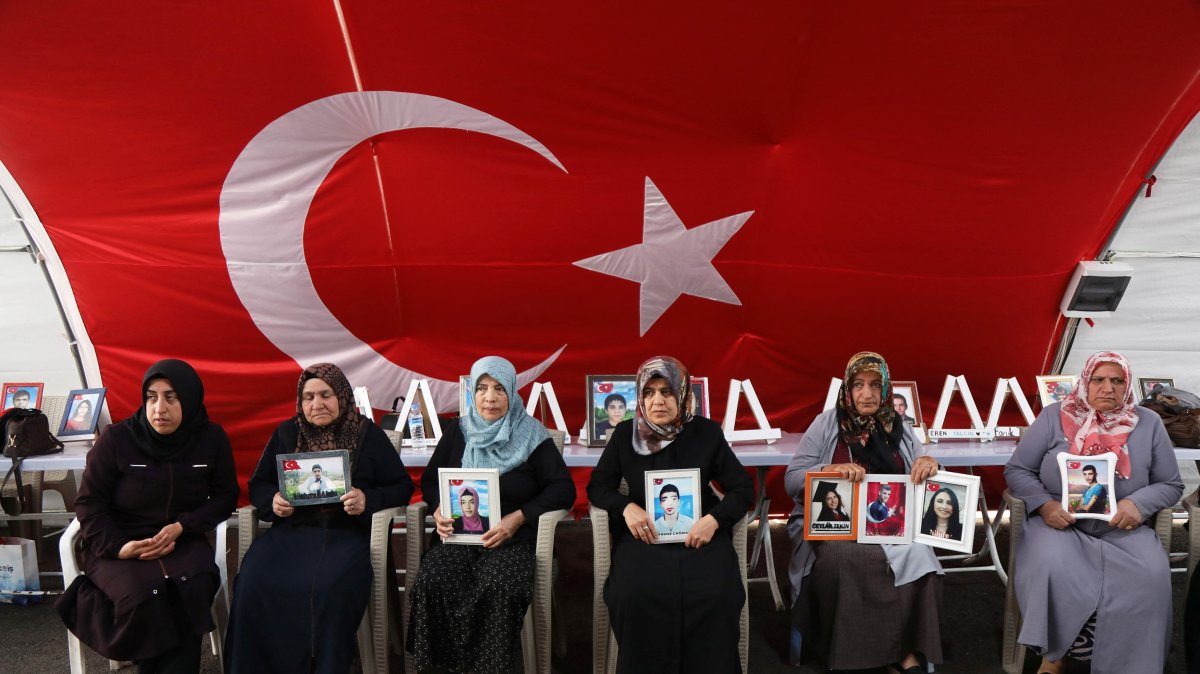 Families, holding photographs of their children abducted by the PKK, gather outside the local office of the Peoples&#039; Equality and Democracy Party (DEM Party), as the PKK disbands and ends a 40-year Türkiye insurgency, Diyarbakır, southeastern Türkiye, May 12, 2025. (Reuters Photo)