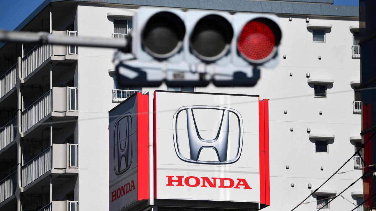 A signboard with the logo of Japanese automaker Honda Motor is seen on the roof of their showroom, Tokyo, Japan, Feb. 6, 2025. (AFP Photo)