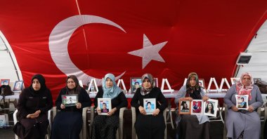 Families, holding photographs of their children abducted by the PKK, gather outside the local office of the Peoples&#039; Equality and Democracy Party (DEM Party), as the PKK disbands and ends a 40-year Türkiye insurgency, Diyarbakır, southeastern Türkiye, May 12, 2025. (Reuters Photo)