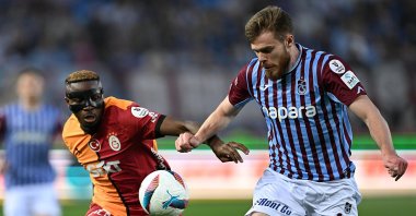 Trabzonspor&#039;s Arseniy Batagov (R) challenges Galatasaray&#039;s Victor Osimhen during a Süper Lig match at Papara Park, Trabzon, Türkiye, May 10, 2025. (AA Photo)
