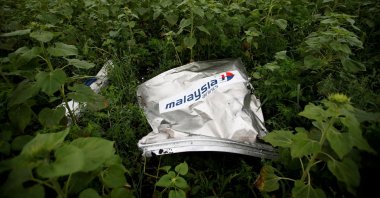 Debris from a Malaysian Airlines Boeing 777 lies on the ground near the village of Rozsypne in the Donetsk region, Ukraine, July 18, 2014. (Reuters Photo)