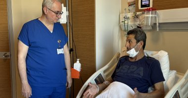 Ersin Şimşek, 47, speaks with his doctor following a liver transplant, Antalya, southern Türkiye, May 12, 2025. (AA Photo)
