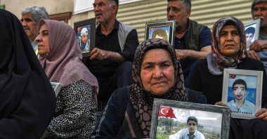 &quot;Diyarbakır Mothers,&quot; the group pleading for the return of their children brainwashed to join the PKK, hold photos of children, Diyarbakır, southeastern Türkiye, May 12, 2025. (AFP Photo)