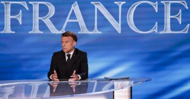 President Emmanuel Macron gestures on the set during his guest appearance on a special program of the French channel TF1 in Saint-Denis, France, May 13, 2025. (EPA Photo)