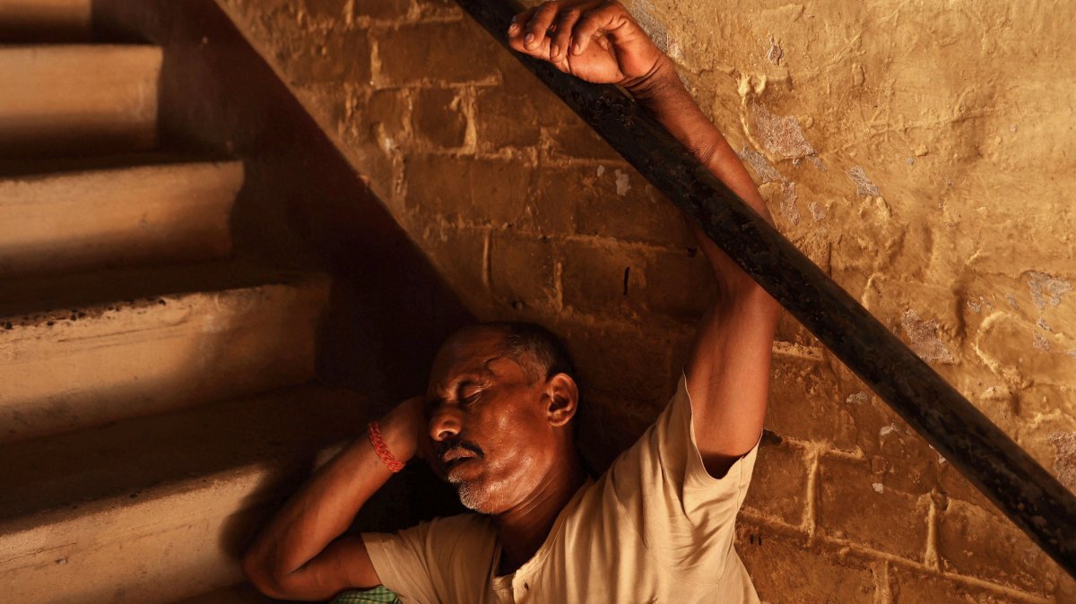 An Indian worker rests during a hot afternoon in the Burrabazar neighborhood in Kolkata, India, May 13, 2025. (EPA Photo)