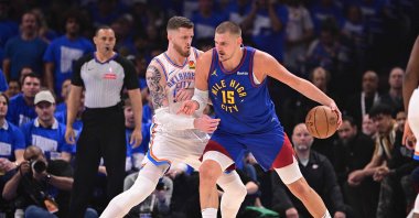 Denver Nuggets&#039; Nikola Jokic (R) posts up against Oklahoma City Thunder&#039;s Isaiah Hartenstein during the first half of game five of the Western Conference semifinals at Paycom Center, Oklahoma City, U.S., May 13, 2025. (AFP Photo)