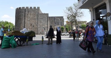 People stroll in the historical Sur district after the announcement of the PKK&#039;s dissolution, Diyarbakır, southeastern Türkiye, May 12, 2025. (AFP Photo)