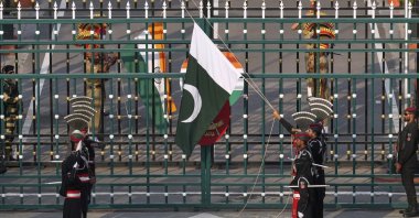 Pakistan&#039;s Rangers soldiers and Indian Border Security Forces soldiers lower their flags during a daily closing ceremony at the Wagah, on Pakistan and India border, near Lahore, Pakistan, May 5, 2025. (AP Photo)