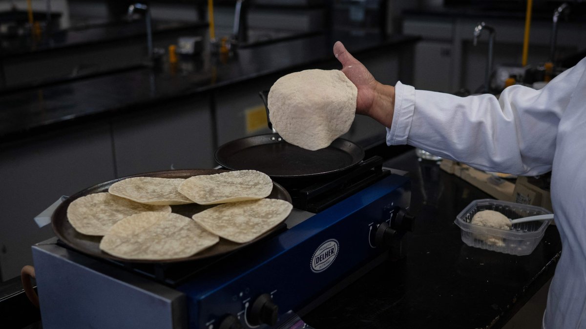 Raquel Gomez Pliego prepares &quot;super tortillas&quot; at the Industrial Microbiology laboratory of the National Autonomous University of Mexico (UNAM), Mexico City, Mexico, April 10, 2025. (AFP Photo)