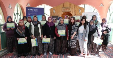 Women from Burdur Mehmet Akif Ersoy University proudly receive their certificates after completing the Village University training program, Burdur, Türkiye, May 15, 2025. (DHA Photo)
